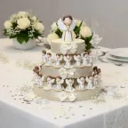 Angelo Rosario bimbo lux bomboniere comunione su portaconfetti a torta