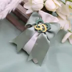 Sacchetto con Fedi Intrecciate in Legno - Bomboniera per Promessa di Matrimonio