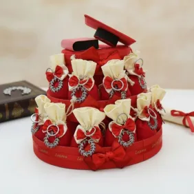 Bomboniera Laurea Corona di Alloro su Torta 25 Sacchetti e Confetti