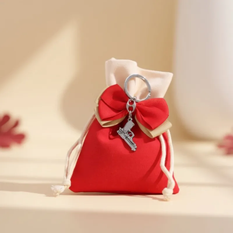 Portachiave Pistola su Sacchetto Bomboniere Confezionate